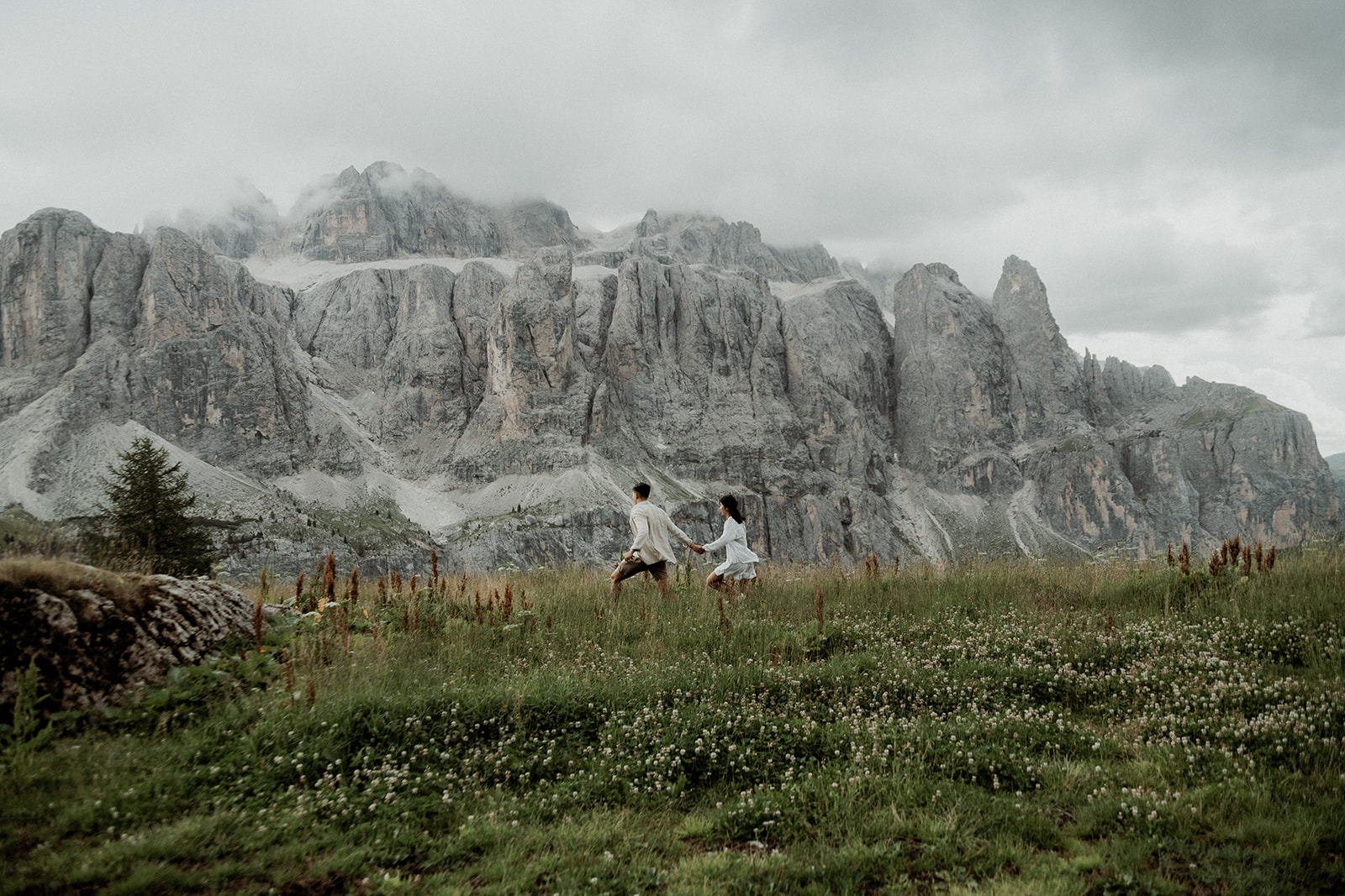 Romantic candid moment during an adventurous Dolomites engagement session