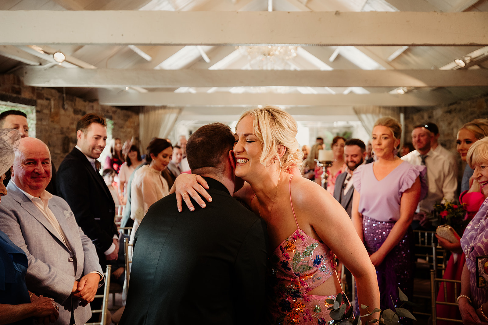 Jean smiling as she greets John during their Ballymagarvey Village wedding ceremony